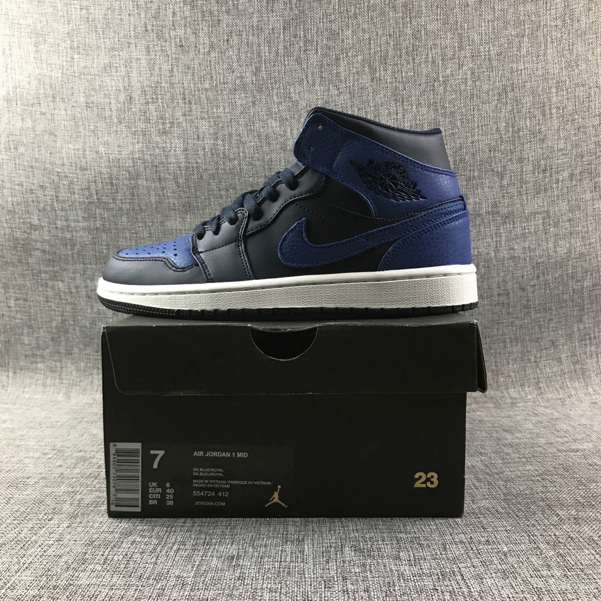 Air Jordan 1 Mid Black and Royal Blue High-Top Sneakers